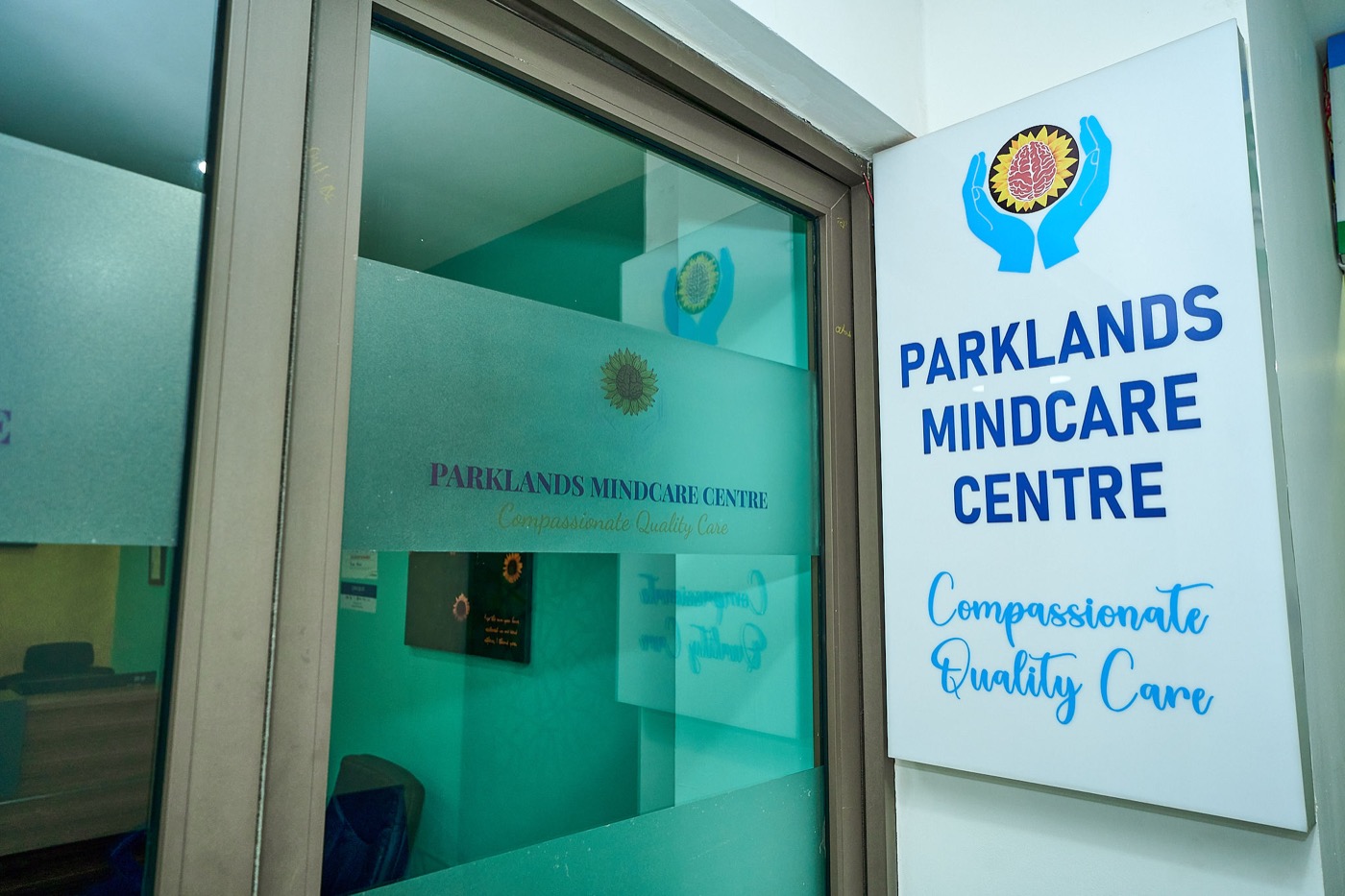 Exterior signage at the entrance to Parklands Mindcare Centre, showing the practice logo and tagline