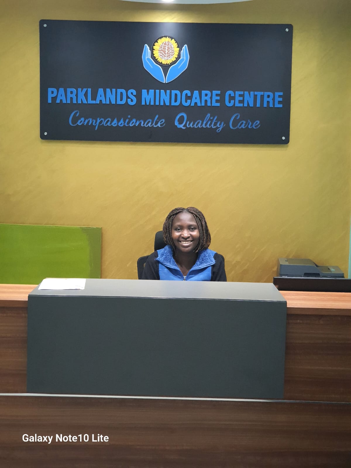 The reception at Parklands Mindcare Centre, Suite 110, Parklands. Practice signage and Compassionate Quality Care tagline visible in the background.